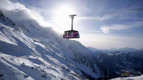 Gondola / Cablecar going through the sun in Skiresort Stock Footage 108683634