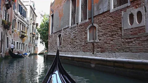 Gondola on canal in Venice Stock Footage