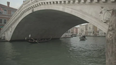 Gondola Going Through Bridge in Pier in Venice, Italy Video stock 148694552