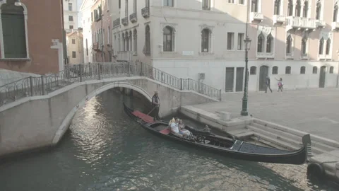 Gondola Going Under Bridge in Venice, Italy Stock Footage 148656024
