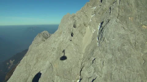Gondola shadow while ascending mountain in Tirol Stock Footage 58624217