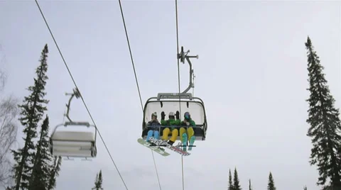 Gondola in Sheregesh ski resort lift people and they greet videographer Stock Footage