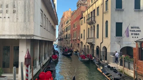 Gondolas at crowded and narrow Venetian canal. Heavy traffic. Venice, Italy. Stock-Footage 160664053