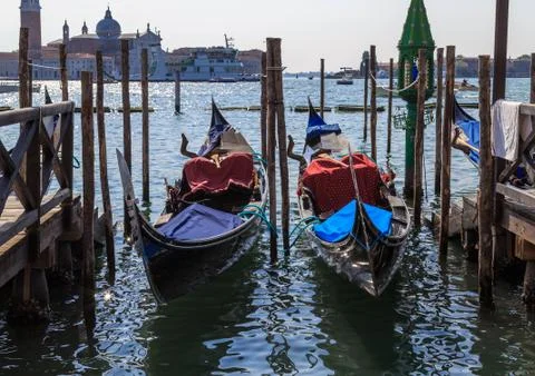 Gondolas on the dock in Venice Stock Photos