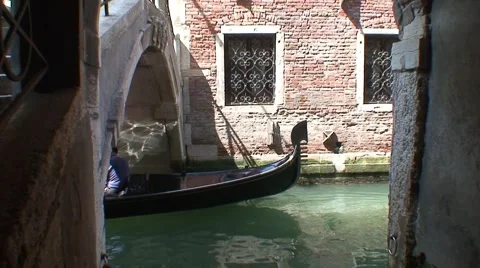 Gondolas Emerge from under Pretty Venice Bridge Stock Footage 1039480