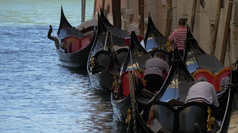 Gondolas floating near a building in Venice Stock Footage 57233394