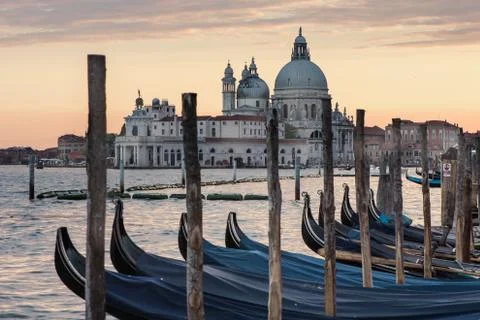 Gondolas floating in waters of lagoon in front of the famous basilica Stock Photos