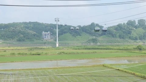 Gondolas going over the DMZ Stock Footage 245020317