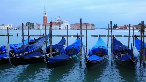 Gondolas moored by Saint Mark square with San Giorgio di Maggiore church Stock Footage 73150838