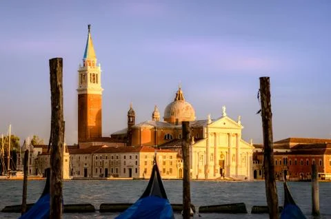 Gondolas moored by Saint Mark square with San Giorgio di Maggiore church back 스톡 사진