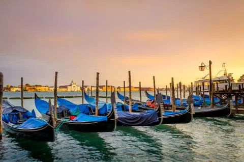 Gondolas moored by Saint Mark square with San Giorgio di Maggiore church back 스톡 사진
