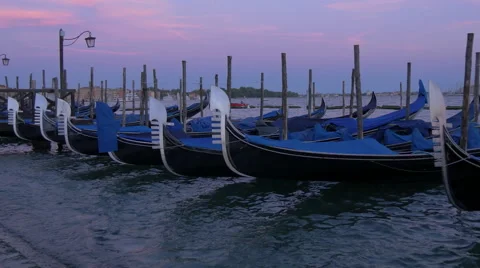Gondolas moored in Venice at dusk Stock Footage 57200546