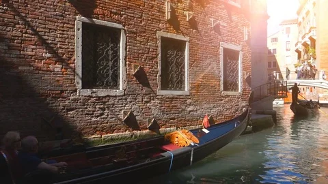 Gondolas, rowed by a gondoliers passing in canals, Venice Vídeo Stock 76708512