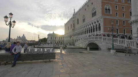 Gondolas sailing towards a bridge near Palazzo Ducale in Venice Video stock 59354570