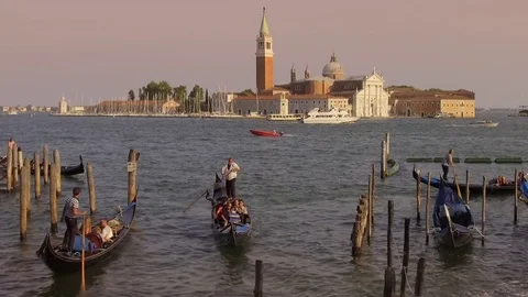 Gondolas at Saint Mark's Square looking towards San Giorgia Maggiore, Venice  Stock Footage 83308355