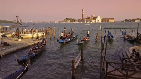 Gondolas at Saint Mark's Square looking towards San Giorgia Maggiore, Venice  Stock Footage 83346745