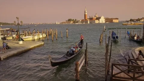 Gondolas at Saint Mark's Square looking towards San Giorgia Maggiore, Venice  Stock Footage 83389389