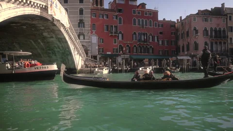 Gondolas under the Rialto Bridge in Venice, Italy. Stock Footage 165871798