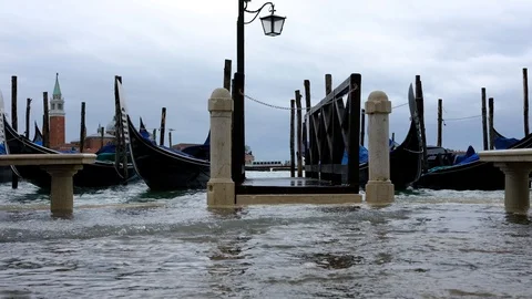 Gondolas on the wave at Piazza San Marco. Venice. Italy Video stock 90486738