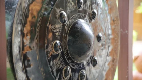 Gong hitting bell Stock Footage 103799453