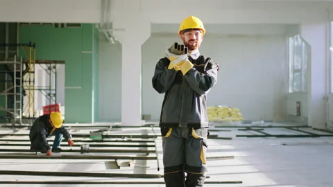 Good equipment construction worker walking at construction site and holding the Video stock 170141940
