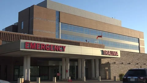 Good establishing shot of a generic modern hospital with emergency room and Stock Footage 164450249