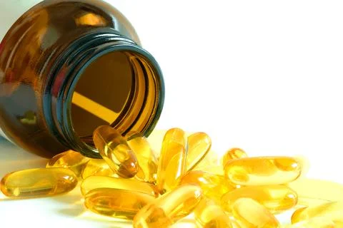 Good fatty fish oil and vitamin E supplements, health and body. Stock Photos