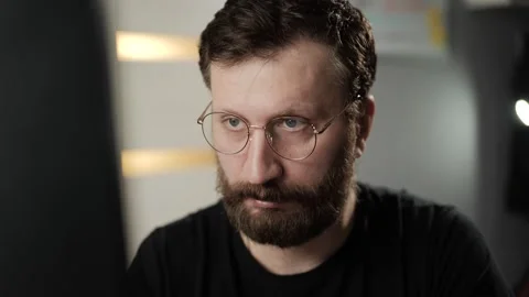 Good idea concept. Thoughtful bearded man with glasses gets inspired by new grea Stock-Footage 303948265