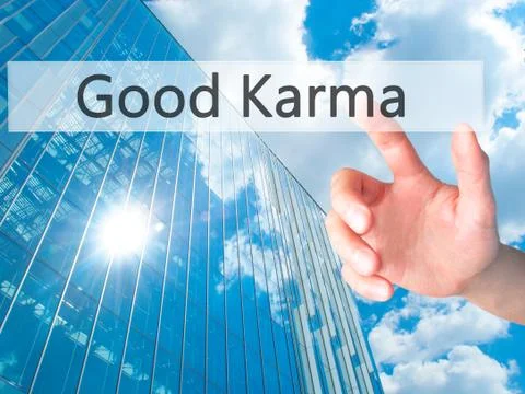 Good Karma - Hand pressing a button on blurred background concept on visual s Stock-Fotos