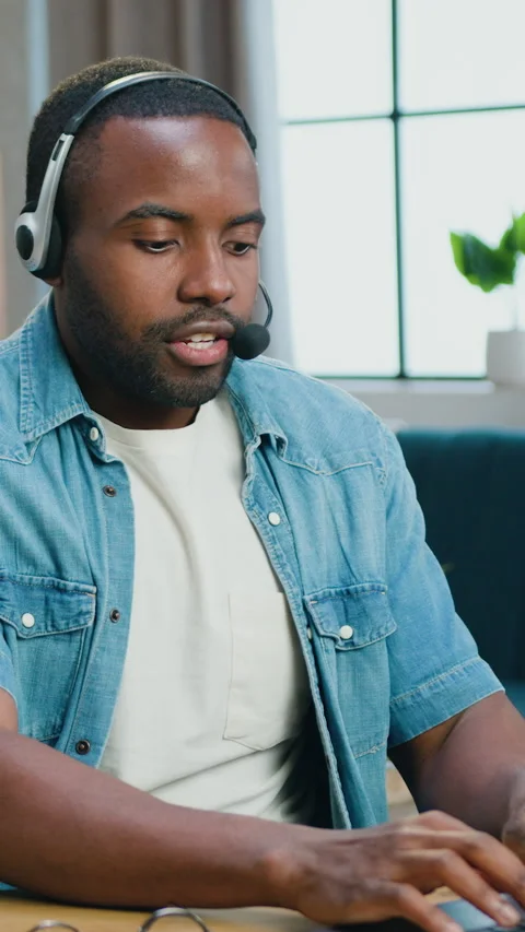 Good-looking African American man in headset recording new video for his interne Stock Footage 325315519