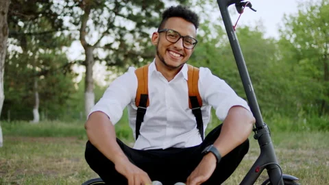 Good looking Afro American guy looking straight to the camera wearing headphones Stock Footage 146977295