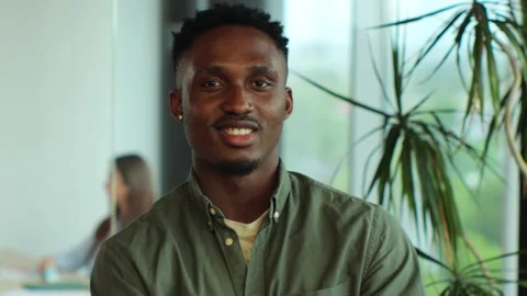 Good looking afro american man team leader in modern company office. Portraits Stock Footage 155167891