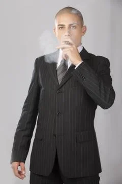 Good Looking Businessman on Gray Stock Photos