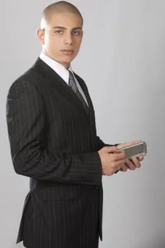 Good Looking Businessman on Gray Stock Photos