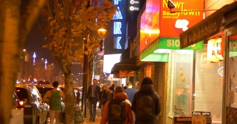 Good looking caucasion couple walking cambie village Stock Footage 119220149