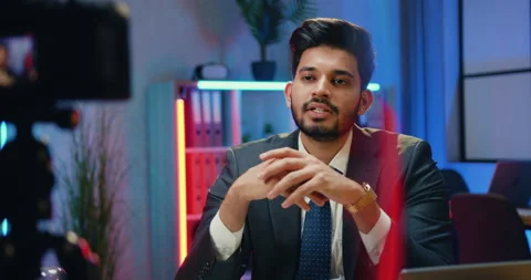 Good-looking confident experienced bearded businessman-blogger in suit recording Stock Footage 166554045