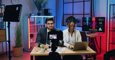 Good-looking confident in good mood skilled bearded businessman and his african Video stock 166692038