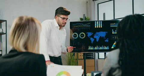 Good-looking confident high-skilled bearded businessman explaining presentation Stock Footage 161070514