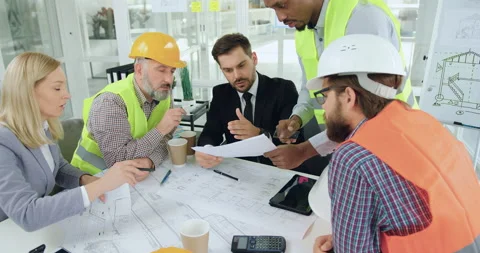 Good-looking confident professional mixed races specialists-builders gathering Stock Footage 145609433