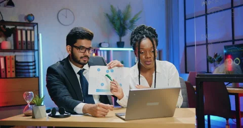 Good-looking confident responsible experienced diverse businesspeople sitting in Stock Footage 166725258