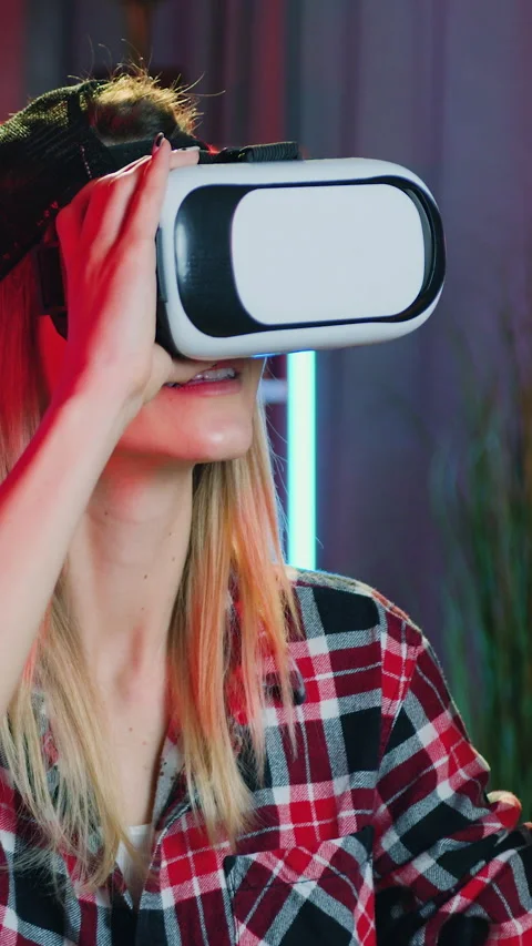 Good-looking confident satisfied 25-aged trendy woman in augmented reality goggl Stock Footage 329507392