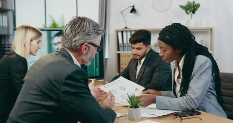 Good-looking creative professional skilled mixed race businesspeople Stock Footage 161016804