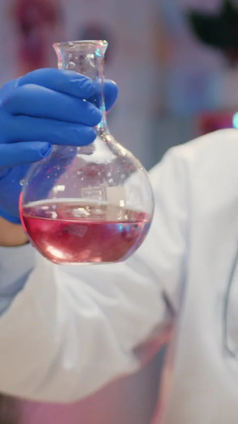 Good-looking experienced responsible bearded scientist biologist in white coat a Stock Footage 330677275