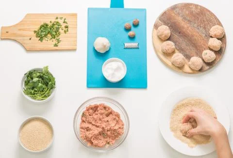 Good-looking female hands while preparing delicious traditional italian meatb Stock Photos