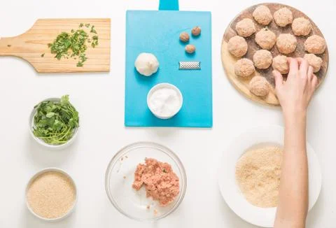 Good-looking female hands while preparing delicious traditional italian meatb Stock Photos