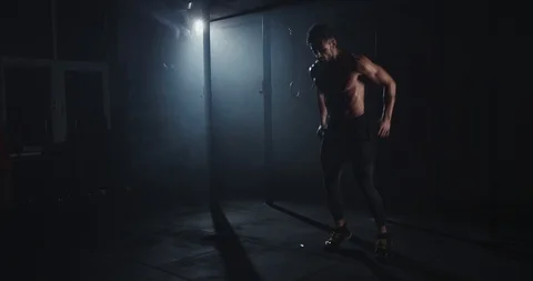Good looking fit body guy doing a intense and hard workout training push-ups in Stock Footage 125480565