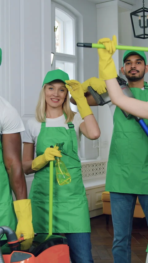 Good-looking friendly satisfied professional men and women of cleaning service i Stock Footage 327871038
