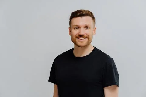 Good looking ginger man smiling at camera, expressing positivity Stock Photos
