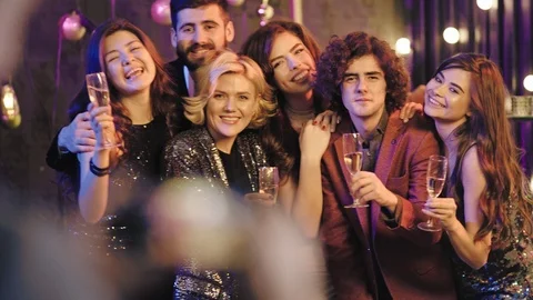 Good looking group of colleagues from work have a fun Christmas stuff party Video stock 122074348