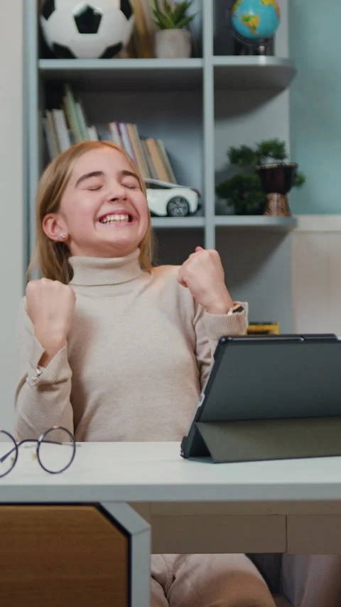 Good-looking happy laughing student girl with tablet pc over home room backgroun Stock Footage 330194078